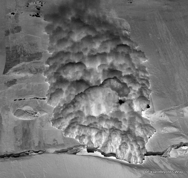 An avalanche rips down towards 14,000 ft camp on Mount Denali.