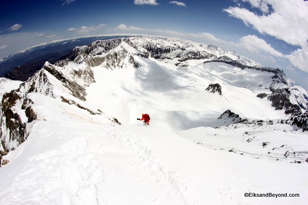 Matt Kamper making turns on the east face.  Almost done.