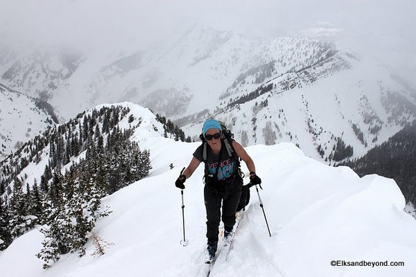 Emma Simonsson gaining the summit as the clouds roll in.