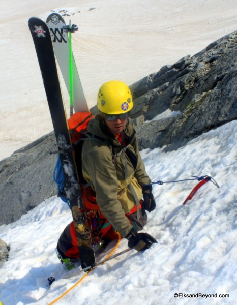 Colter preparing for the climb around the corner.  Pro was scarce at this point so a double ice axe sit belay is what we had to work with. 
