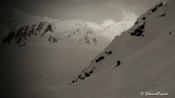 Matt lays a turn over in the shadowy Couloir.