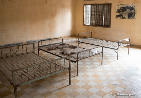 One of the rooms where people would be chained to these cots and tortured in the most unimaginable ways.  Notice the photo in the top right corner on the wall.