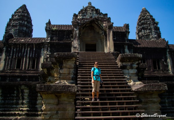 Elisabeth is excited for this. She is a structural engineer, and was looking forward to seeing this for a long long time.  Here she makes the first of many climbs up steep staircases to explore the inner complexities of Angkor Wat.